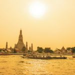 people walking on bridge over body of water during daytime